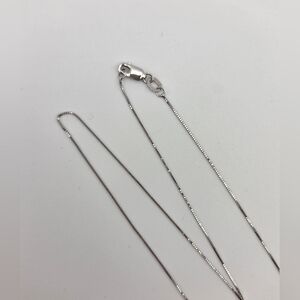 14kt White Gold Box Chain 16" In Lenght .5mm Thick With A Lobster Clasp.